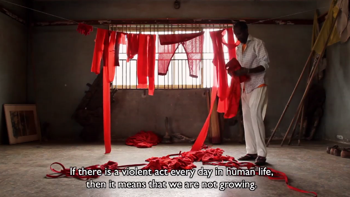 Jelili Atiku, Lagos in Red. Still from the short documentary film (2013). Courtesy of the artist.