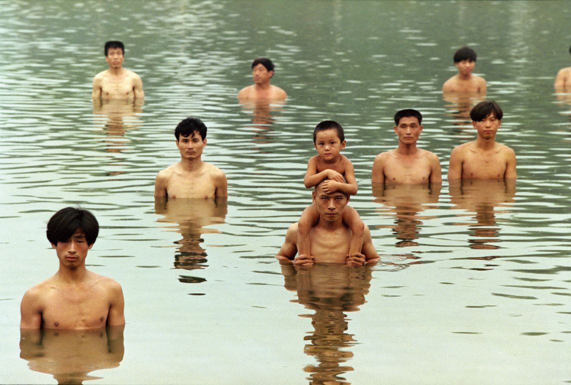 Zhang Huan, To Raise the Water Level in a Fishpond. Performance, Beijing, China (1997). Courtesy of Zhang Huan Studio.