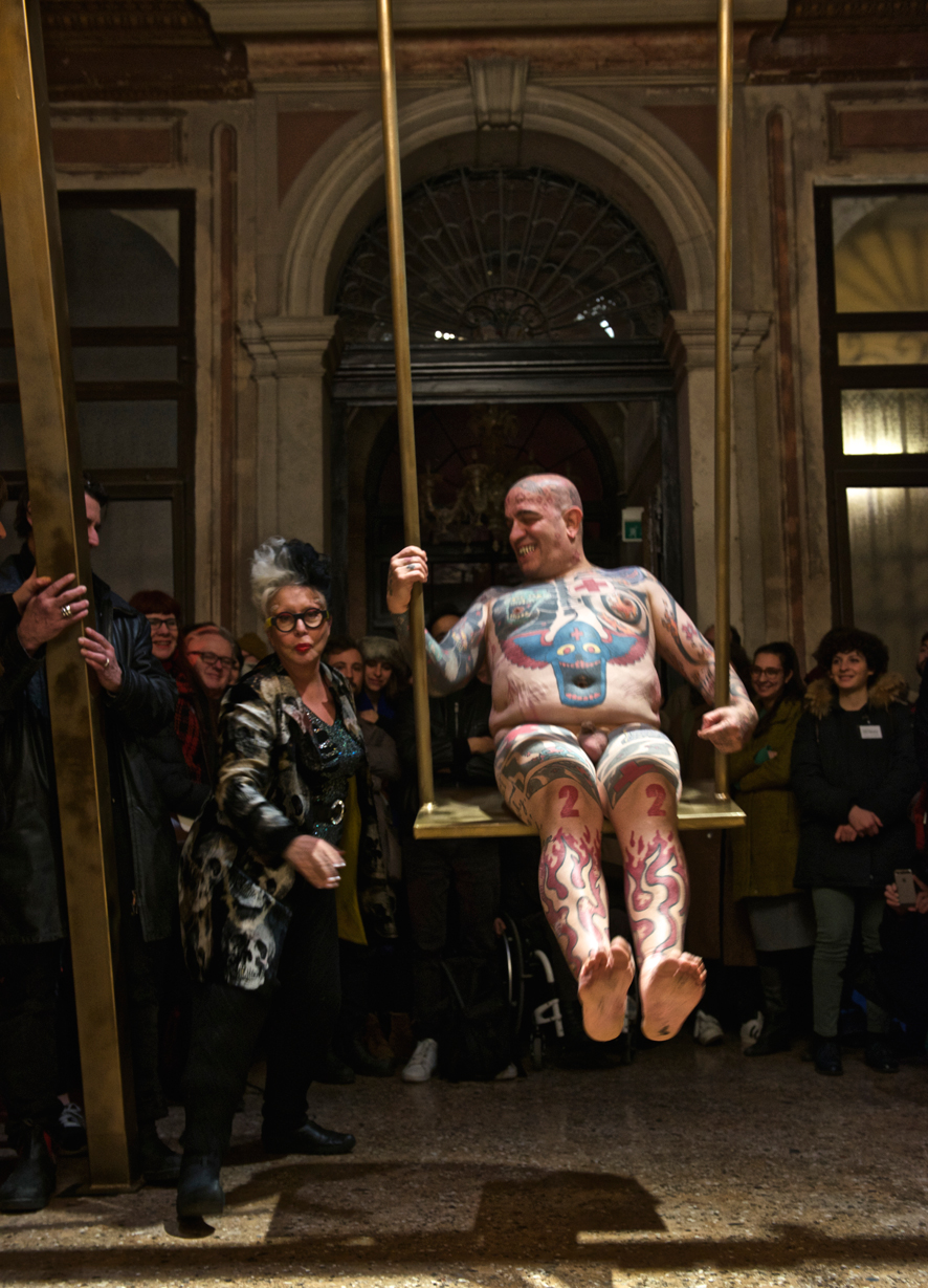 Franko B, I'm Thinking of You. Performance at the III Venice International Performance Art Week 2016. Franko B pushed on his golden swing by ORLAN. Image © Edward Smith